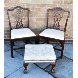 A PAIR OF GEORGE III STYLE MAHOGANY DINING CHAIRS with pierced vase shape splats, and a foot stool