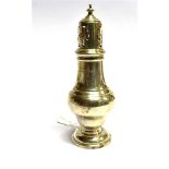 A SMALL SILVER SUGAR CASTER of round lighthouse form on pedestal base, hallmarked Birmingham 1934,