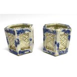 A PAIR OF CHINESE VASES of hexagonal form with reticulated sides, 11cm high