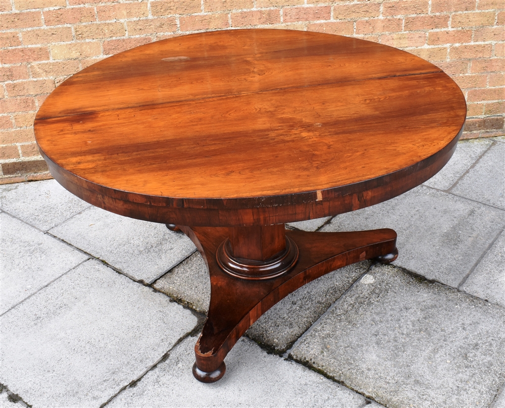 A VICTORIAN ROSEWOOD BREAKFAST TABLE the circular tilt top 130cm diameter, on hexagonal pillar