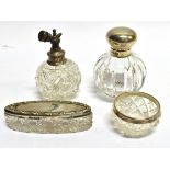 A SILVER TOPPED CUT GLASS PERFUME BOTTLE the perfume bottle complete with stopper of bulbous form