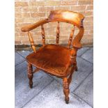 AN ELM, BEECH AND ASH SMOKERS BOW ARMCHAIR on turned supports with double H-shaped stretcher base