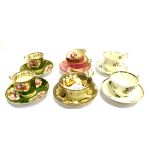 A GROUP OF SPODE AND OTHER 19TH CENTURY FLORAL DECORATED CUPS AND SAUCERS