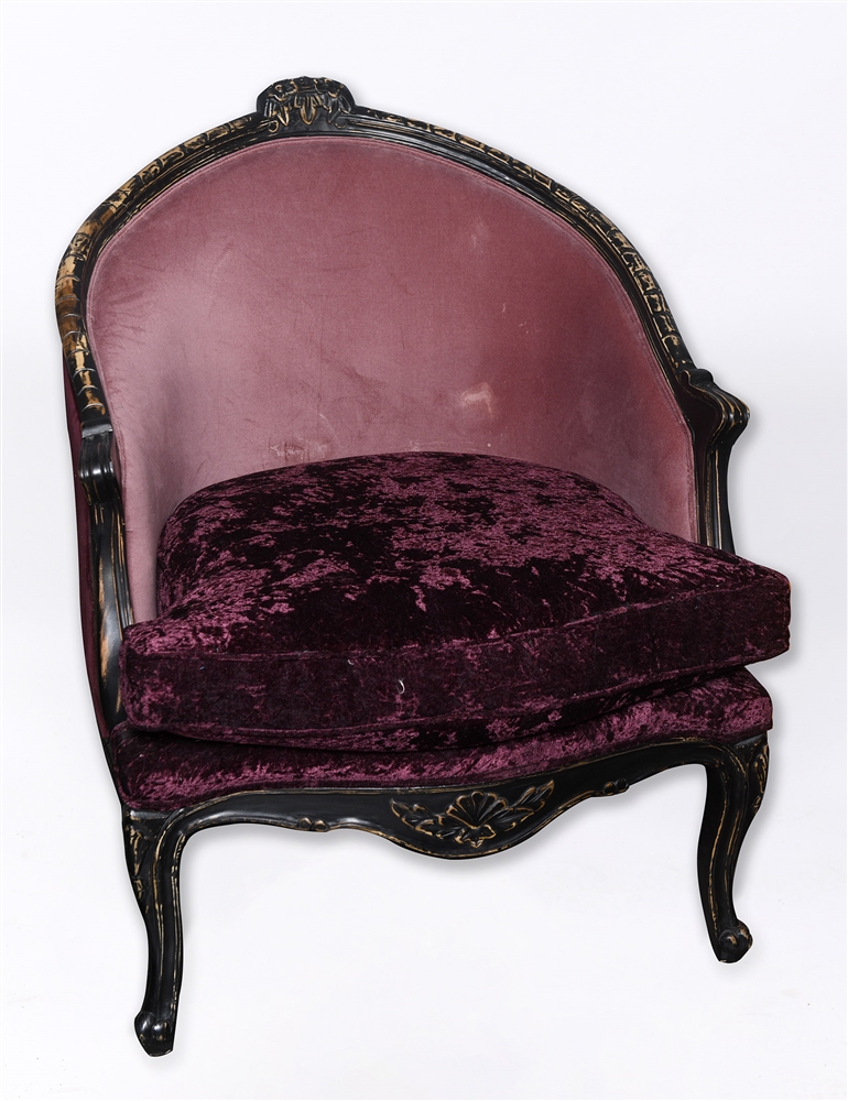 A LARGE LOUIS XVI STYLE FAUTEUIL with ebonised frame, purple upholstery and loose cushion