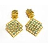 A PAIR OF TURQUOISE SET DROP CLIP EARRINGS the openwork offset square drop and wirework suspension