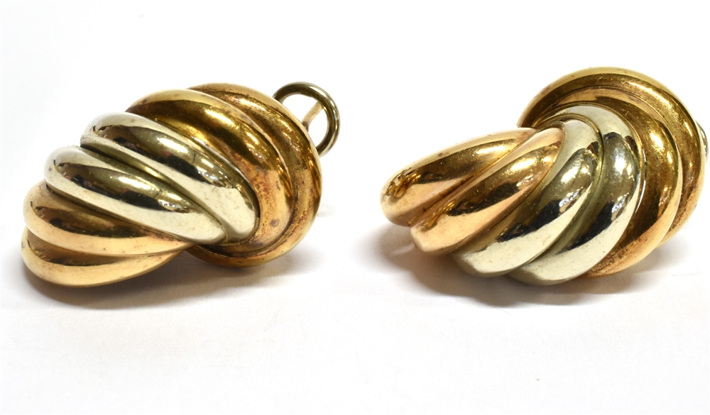 A PAIR OF 9 CARAT TWO COLOURED GOLD EARRINGS coiled twist design, hollow construction, pierced ear