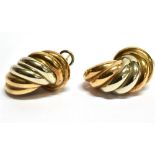 A PAIR OF 9 CARAT TWO COLOURED GOLD EARRINGS coiled twist design, hollow construction, pierced ear