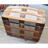 AN AMERICAN METAL BOUND DOME TOP TRAVELLING TRUNK the fitted interior with lift-out compartments and