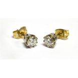 A PAIR OF DIAMOND SOLITAIRE STUD EARRINGS the two round brilliant cut diamonds weighing a total of