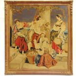 A 19TH CENTURY WOOLWORK PICTURE depicting a group of figures with an infant and a basket of