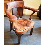 AN EARLY 20TH CENTURY MAHOGANY FRAMED ARMCHAIR with leather upholstered horseshoe shaped back and