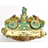 A CONTINENTAL TWO BOTTLE INK STAND with floral encrusted decoration, enamelled with exotic birds,