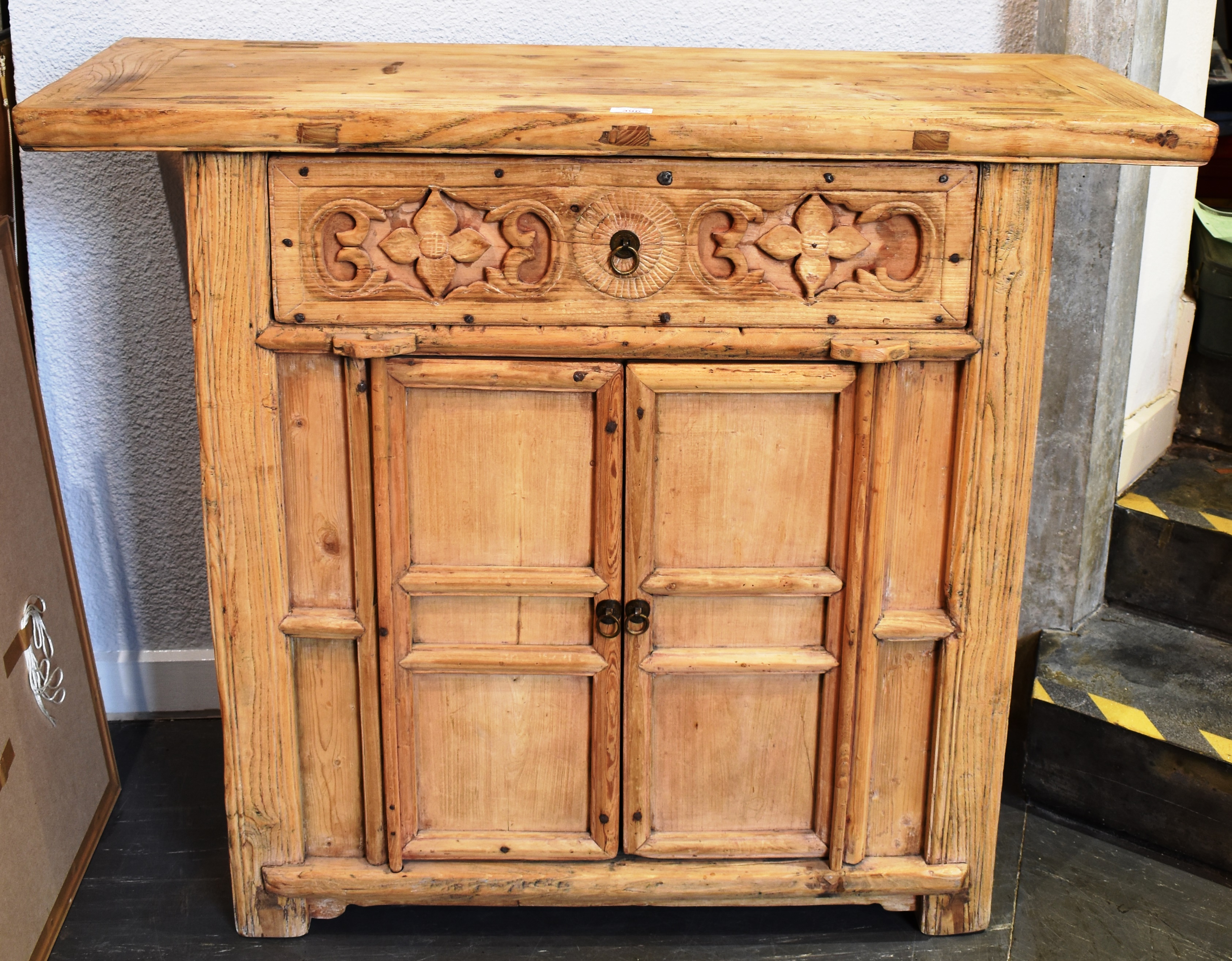 A CHINESE ELM ALTAR TABLE with carved decoration, 111cm wide 44cm deep 99cm high