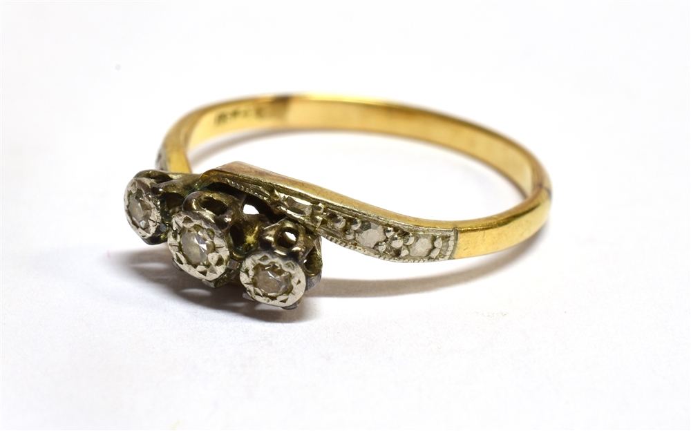 A DIAMOND THREE STONE CROSSOVER 18 CARAT GOLD RING three small illusion set round cut diamonds, ring - Image 3 of 3