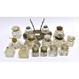 A GROUP OF GLASS INKWELLS including a circular example with integral pen stand 10cm diameter,