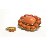 A VICTORIAN ORANGE CORAL SET BROOCH/PENDANT the cushion shaped brooch with cabochon cut orange