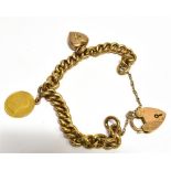 A 9 CARAT GOLD CURB LINK CHARM BRACELET WITH PADLOCK FASTENER padlock fastener hallmarked Birmingham