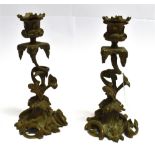 A PAIR OF CONTINENTAL BRASS ROCOCO STYLE CANDLESTICKS with removable sconces, 24cm high