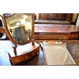 A MAHOGANY DRESSING TABLE MIRROR with shield shaped mirror, the bow front base fitted with three
