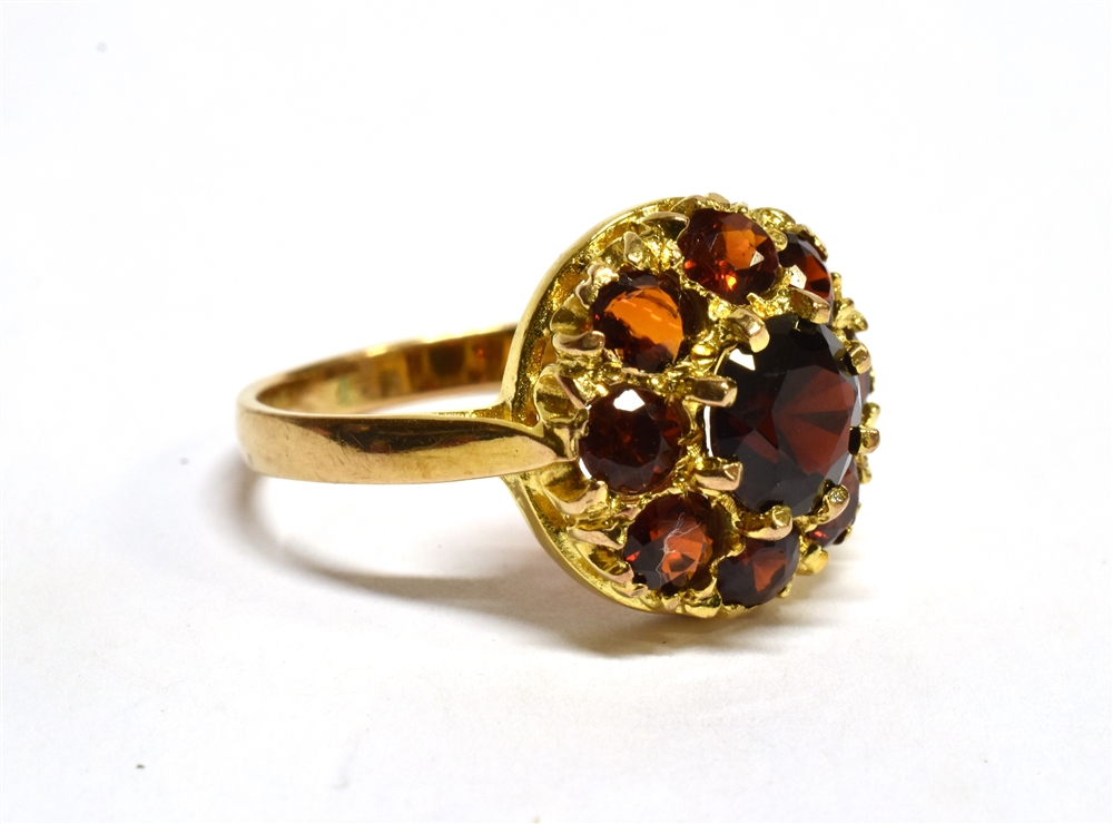 A GARNET ROUND CLUSTER 9 CARAT GOLD DRESS RING central round mixed cut red garnet 6mm diameter, - Image 2 of 3