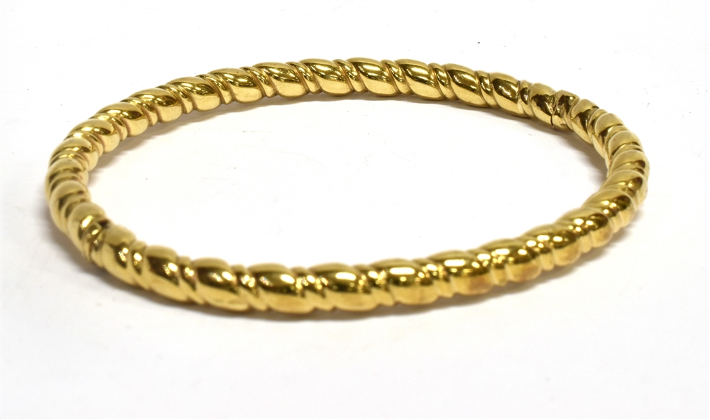 A 9 CARAT GOLD OVAL HINGED BANGLE plain polished barley twist tubular design, tongue snap clasp, - Image 2 of 2