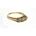 A DIAMOND THREE STONE 9 CARAT GOLD RING three small round brilliant cut diamonds, illusion set, ring