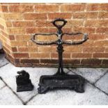 A COALBROOKDALE STYLE CAST IRON STICK STAND with removable drip tray, 47cm wide 70cm high;