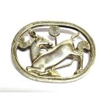 A GEORG JENSEN SILVER KNEELING DEER BROOCH the oval openwork brooch 45mm x 38mm, the reverse with