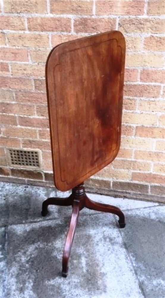 A MAHOGANY TILT TOP OCCASIONAL TABLE the oblong top with line inlaid decoration 44cm x 61cm, on