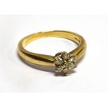 A DIAMOND FLOWERHEAD CLUSTER 9 CARAT GOLD RING cluster comprising seven round brilliant cut