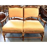 A RUSH SEATED TWO SEATER LADDERBACK CHAIR BACK SOFA with loose cushions