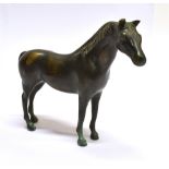 A PATINATED BRONZE FIGURE OF A HORSE 14.5cm high