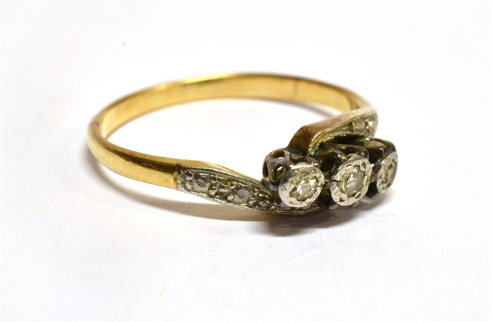 A DIAMOND THREE STONE CROSSOVER 18 CARAT GOLD RING three small illusion set round cut diamonds, ring - Image 2 of 3