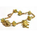 A TURQUOISE SET 9 CARAT GOLD BRACELET with bolt ring fastener, gold spheres each set with four small