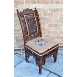 A MOORISH STYLE SIDE CHAIR with upholstered seat mashrabiya pattern panels