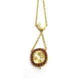 AN EDWARDIAN YELLOW SAPPHIRE AND RED SPINEL CUSHION SHAPED CLUSTER DROP PENDANT suspended from