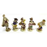 FOUR CONTINENTAL HARD PASTE FIGURES in rococo style, bearing gold anchor mark to base, probably