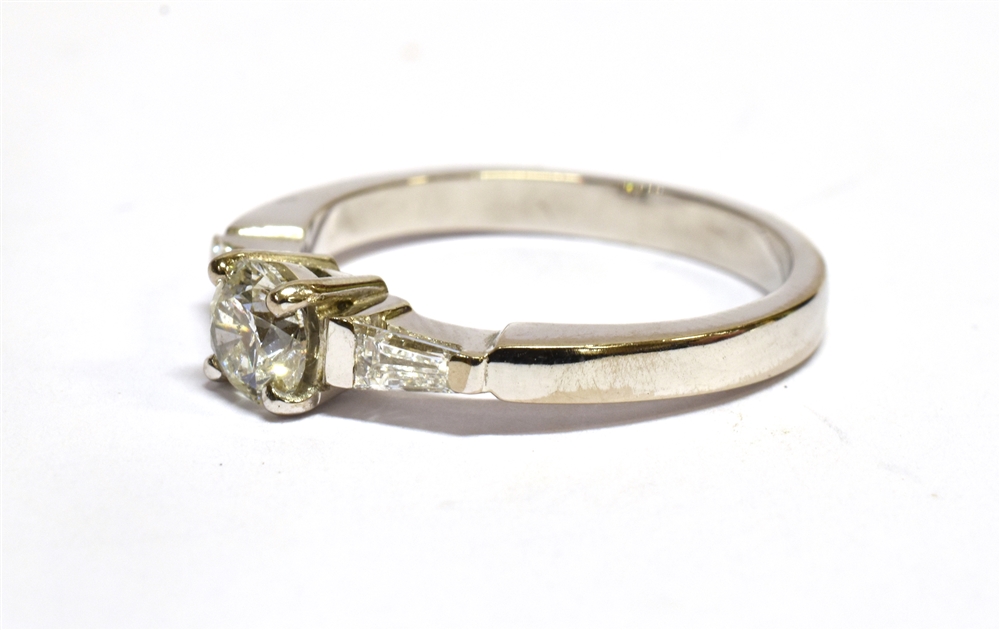 A DIAMOND SOLITAIRE WHITE GOLD RING with diamond set shoulder, the round brilliant cut diamond - Image 3 of 3