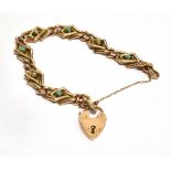 A VICTORIAN 9 CARAT GOLD TURQUOISE AND SEED PEARL SET BRACELET WITH PADLOCK FASTENER tubular work