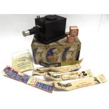 A HEATHWOOD CHILD'S FILM PROJECTOR together with a quantity of film strips, including those of