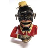 A CAST ALUMINIUM NOVELTY MONEY BANK in the form of a black gentleman wearing a boater hat, the