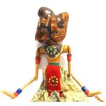 A MALAYSIAN PUPPET of traditional painted and gilded wood form.