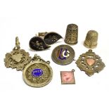 EIGHT SMALL SILVER ITEMS comprising three shield fobs, an enamelled badge, a pair of cufflinks,
