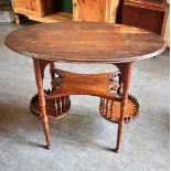 AN EDWARDIAN OAK OCCASIONAL TABLE the oval top 84cm x 45cm, on unusual three tier galleried