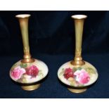 A PAIR OF ROYAL WORCESTER VASES with painted decoration of roses signed 'E M Fildes' (Ellen