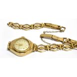 A LADIES VINTAGE 9CT GOLD BRACELET WATCH the small round dial to 9ct gold case, mechanical