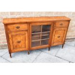 A REPRODUCTION BURR WALNUT AND MAHOGANY SIDE CABINET the shaped front with glazed section