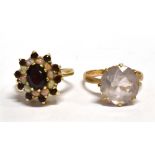 TWO 9CT GOLD DRESS RINGS comprising a garnet and opal three tier cluster, ring size L, and a white