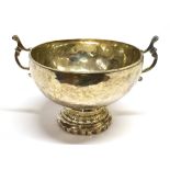 A SILVER TWO HANDLED BOWL scroll work handles to circular plain form bowl on pedestal base,