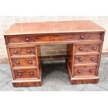 A MAHOGANY TWIN PEDESTAL DESK with plain top and single long frieze drawer above pedestals each